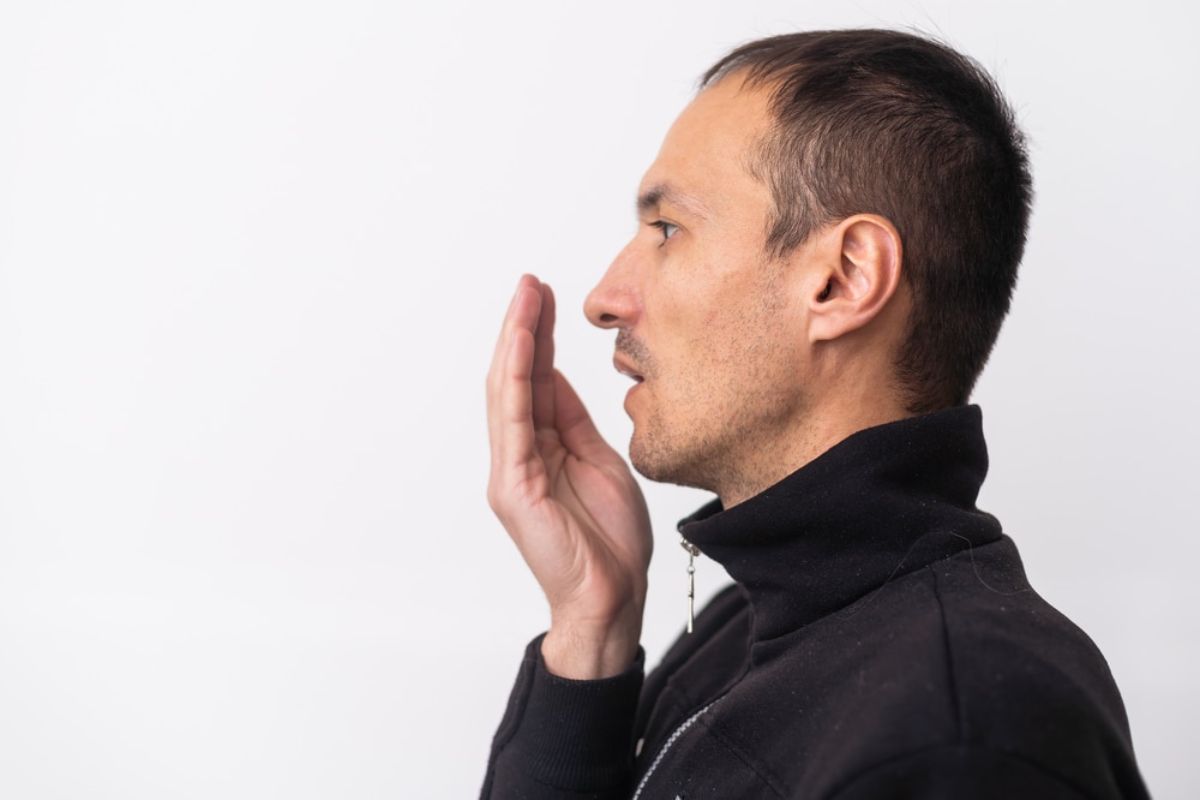 man noticing bad breath before US Independence Day
