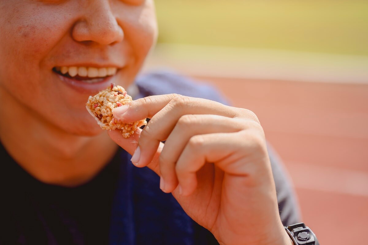 man eating sugary item
