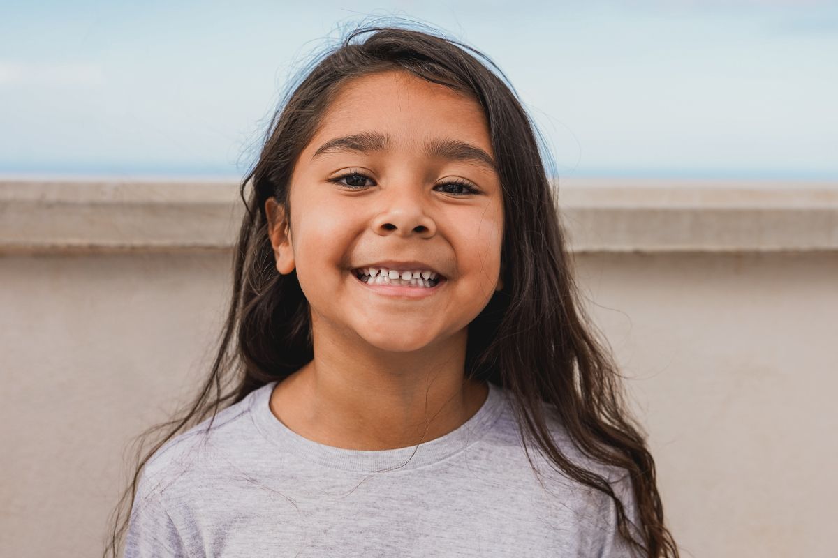 close up of smiling girl after getting dental sealants