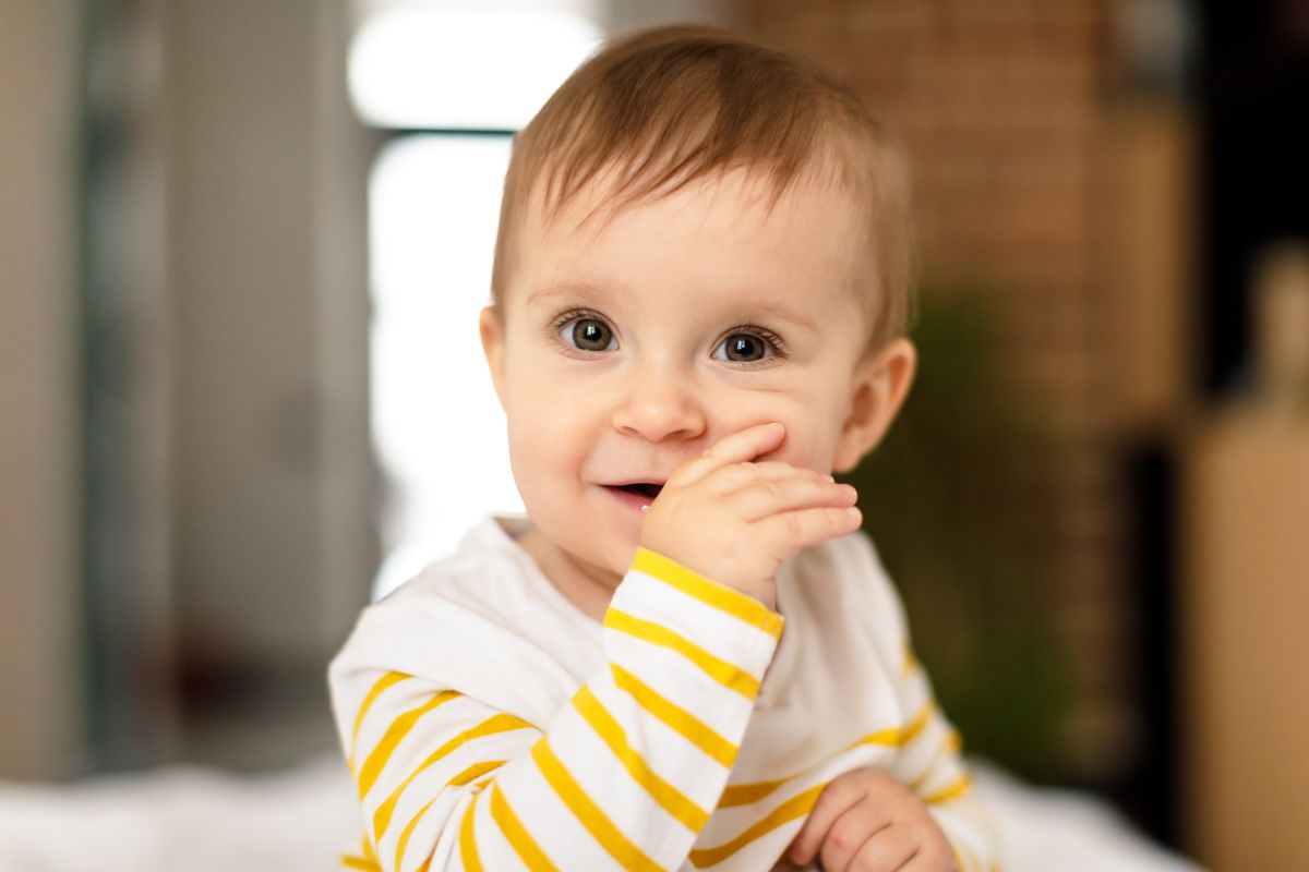 close up of child sucking thumb